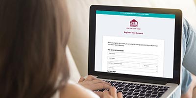 Woman using laptop to register account