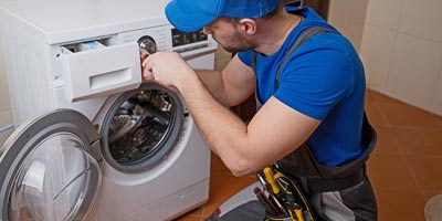 Man repairing washer